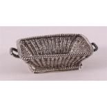 A woven laundry basket with two handles, after an 18th century example.