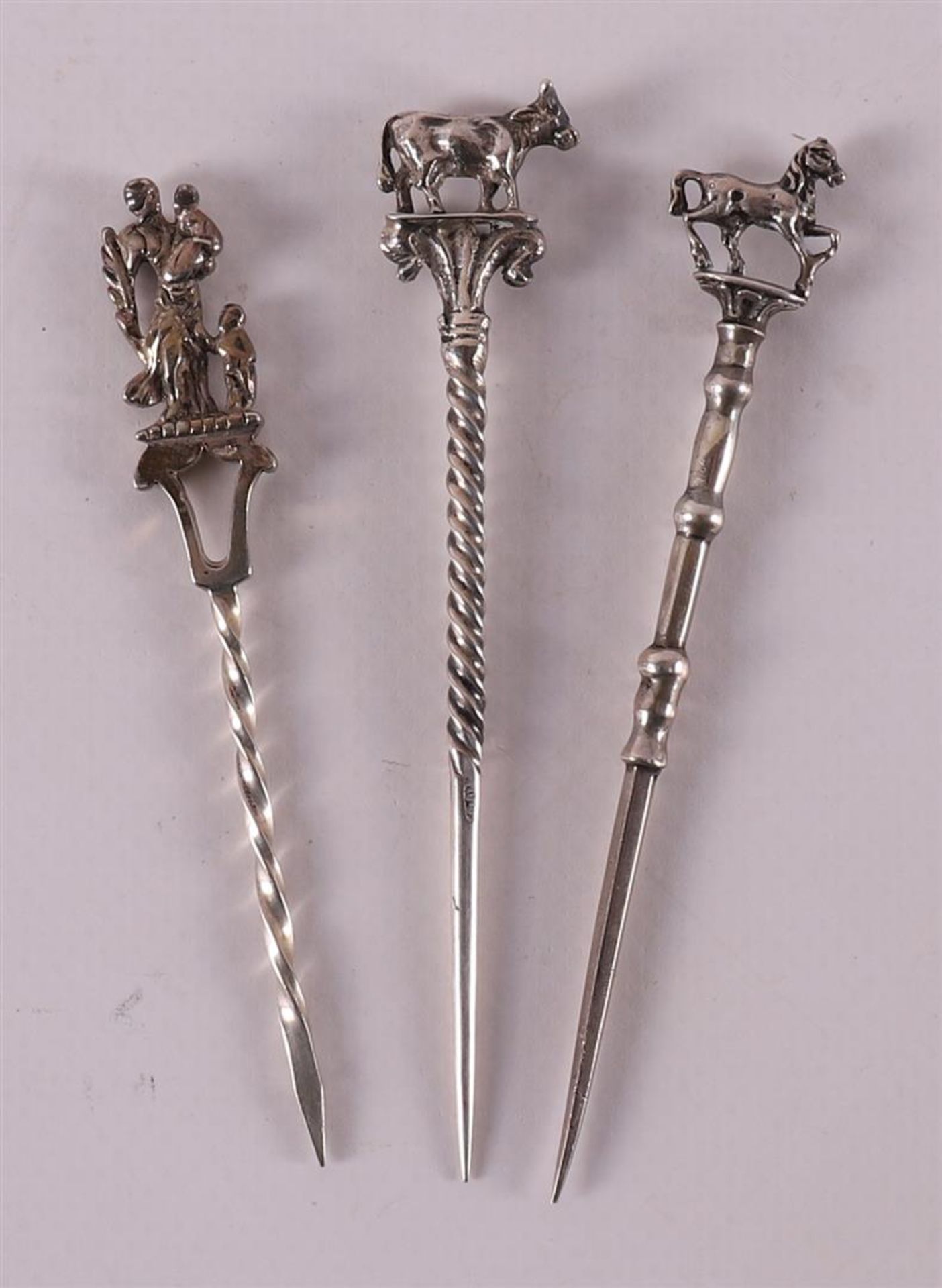 Three second grade 835/1000 silver pipe sticks, 19th/20th century.