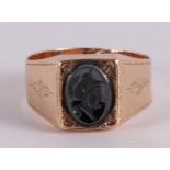 A 14 kt gold cachet ring with black onyx with a minerva head.