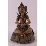 A carved wooden temple statue of a seated man, Indonesia, 19th/20th century