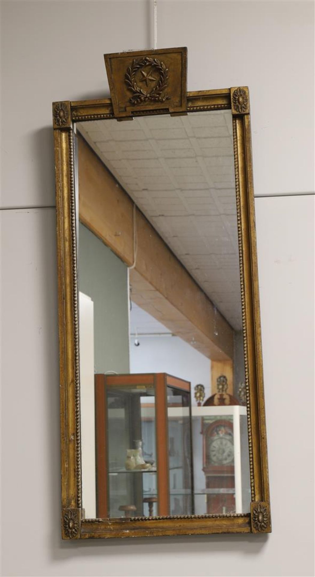 A rectangular Empire mirror in a gilt profile frame, ca. 1810.