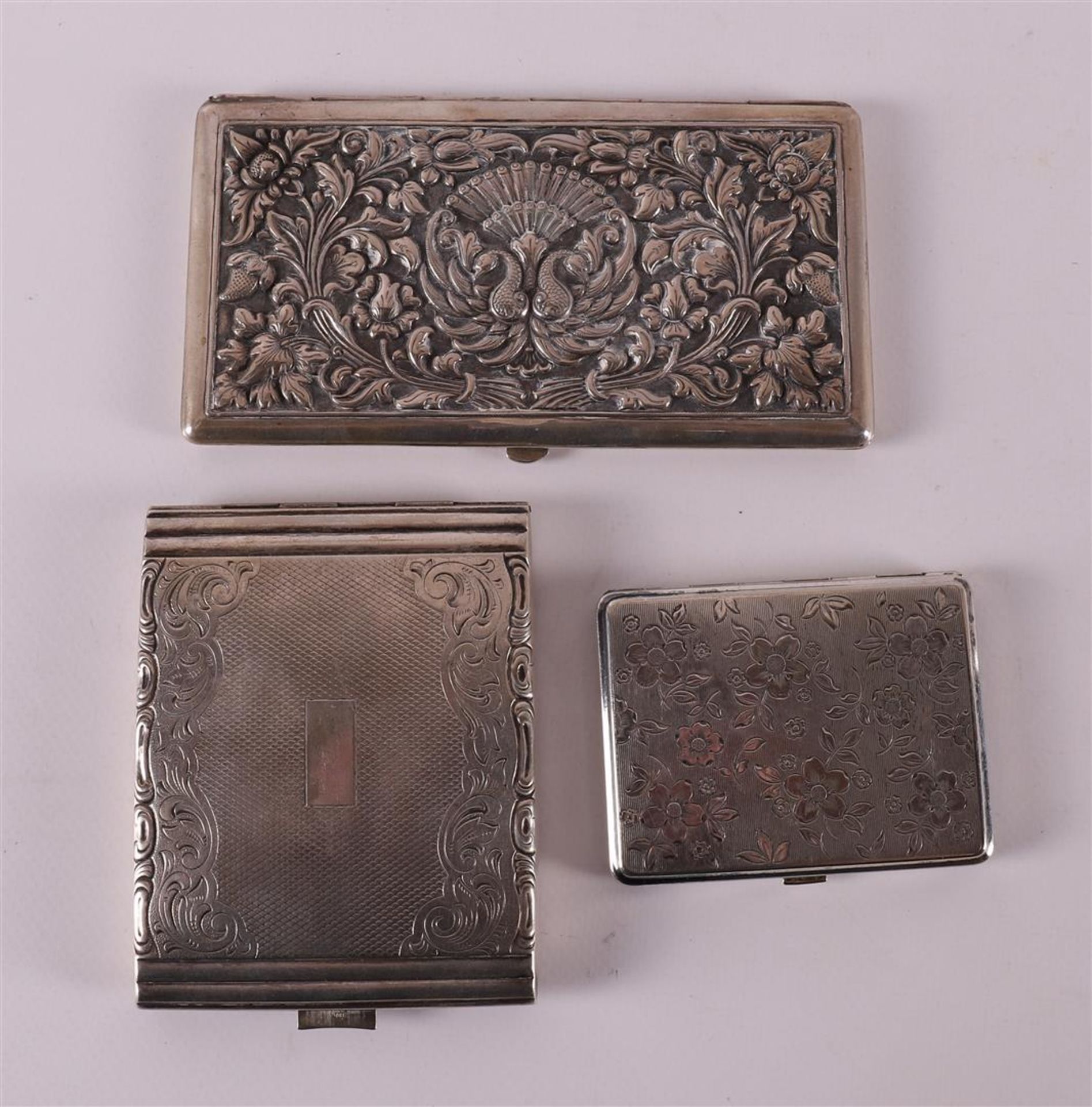 Two third grade 800/1000 silver cigarette cases, including Djocja, early 20th ce