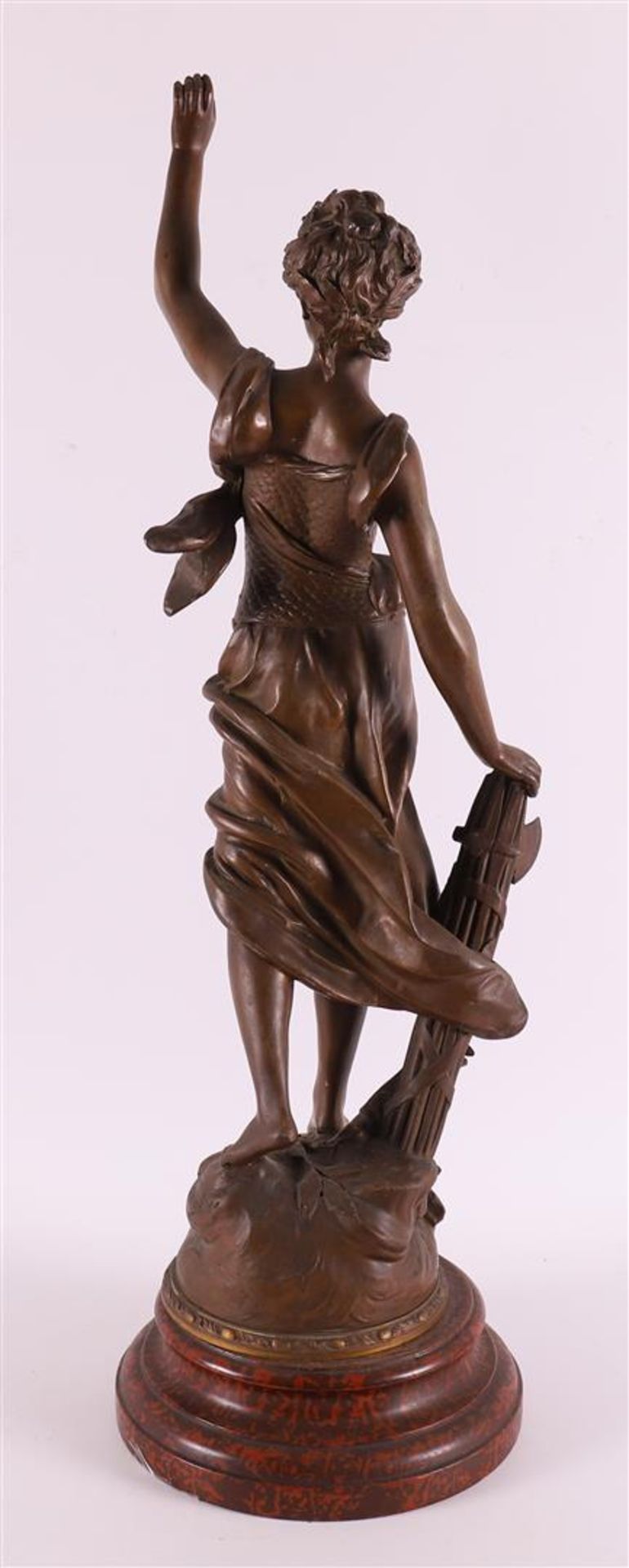 A brown patinated white metal woman 'La Gloire', France around 1900. - Image 2 of 5