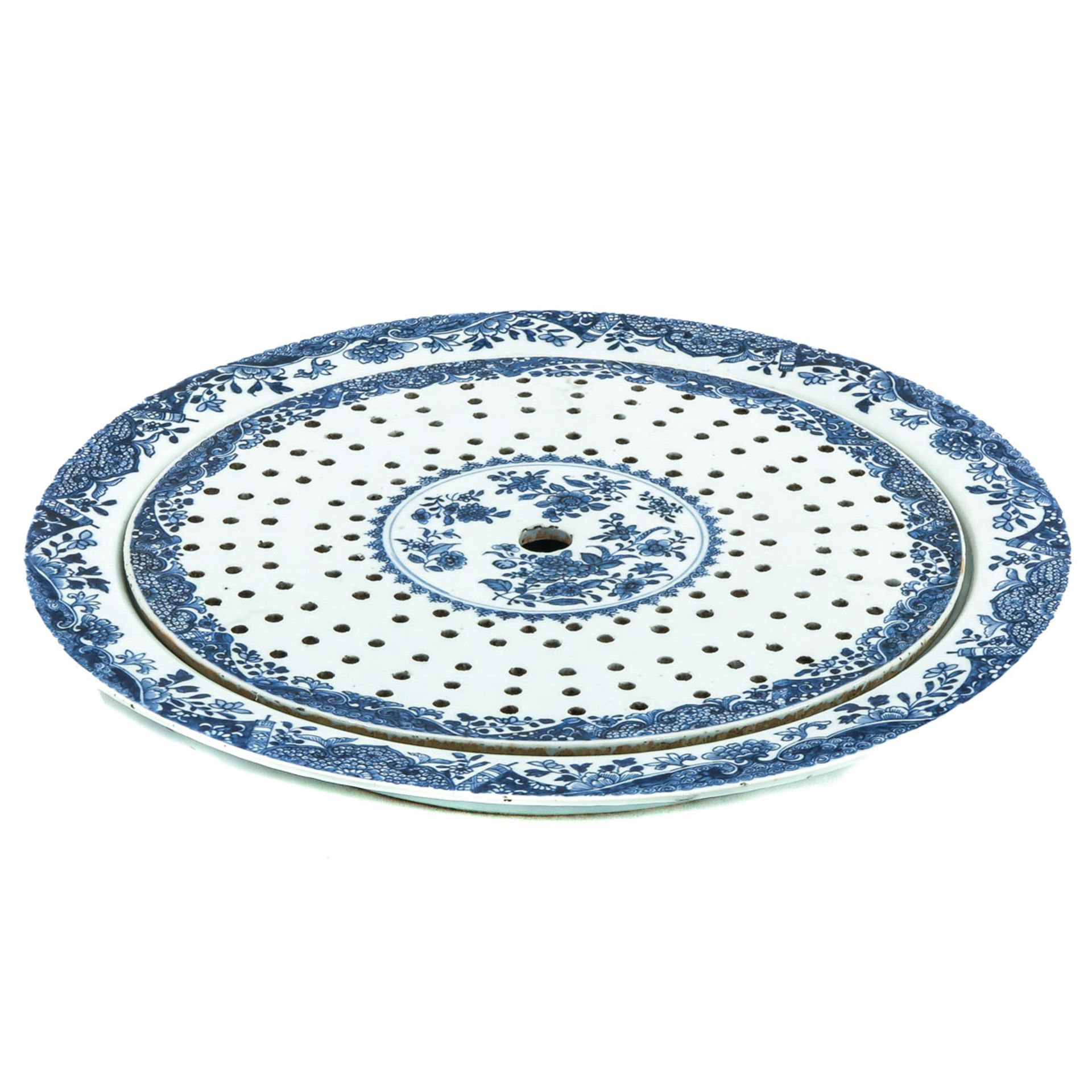 A Blue and White Tray with Strainer