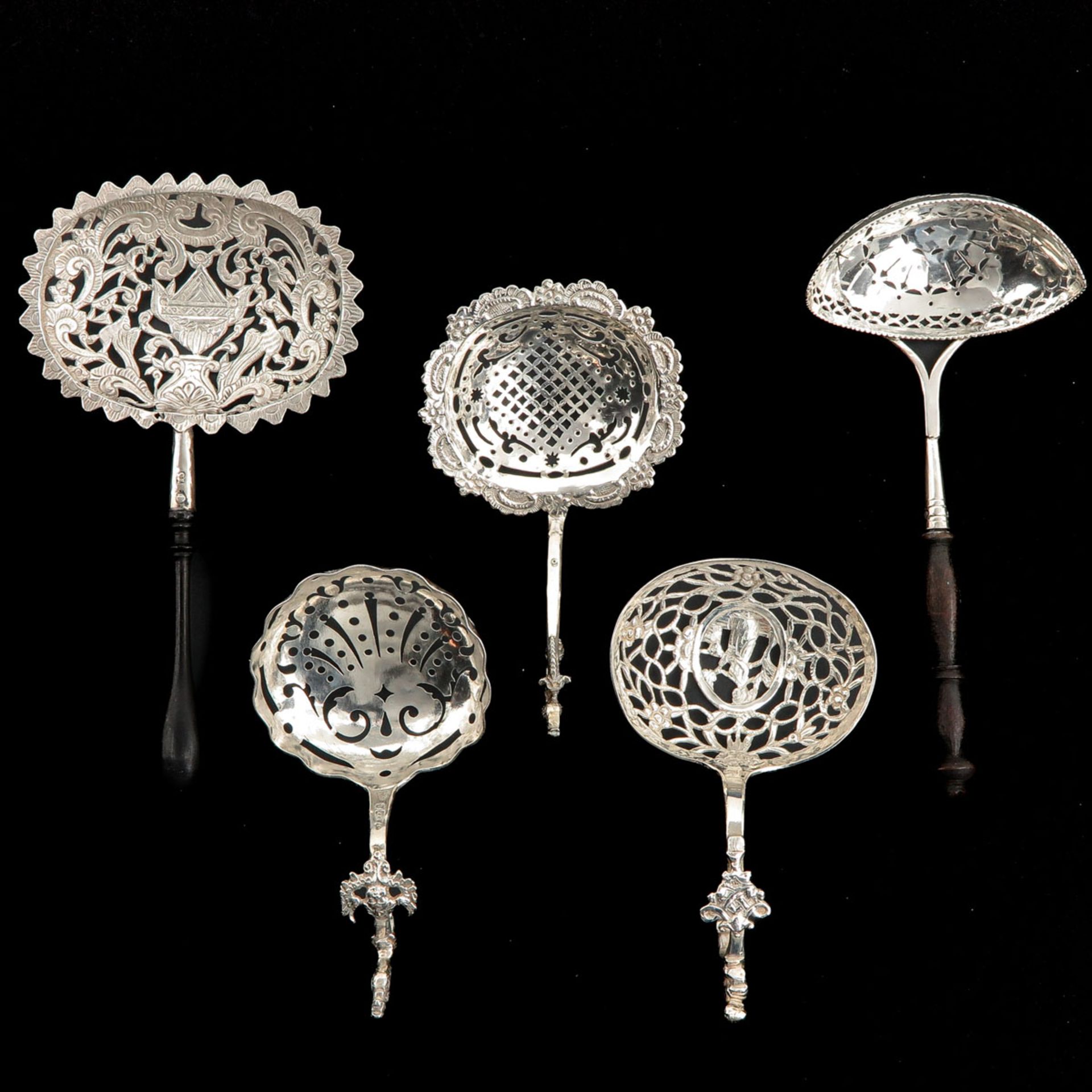 A Collection of 5 Silver Spreaders