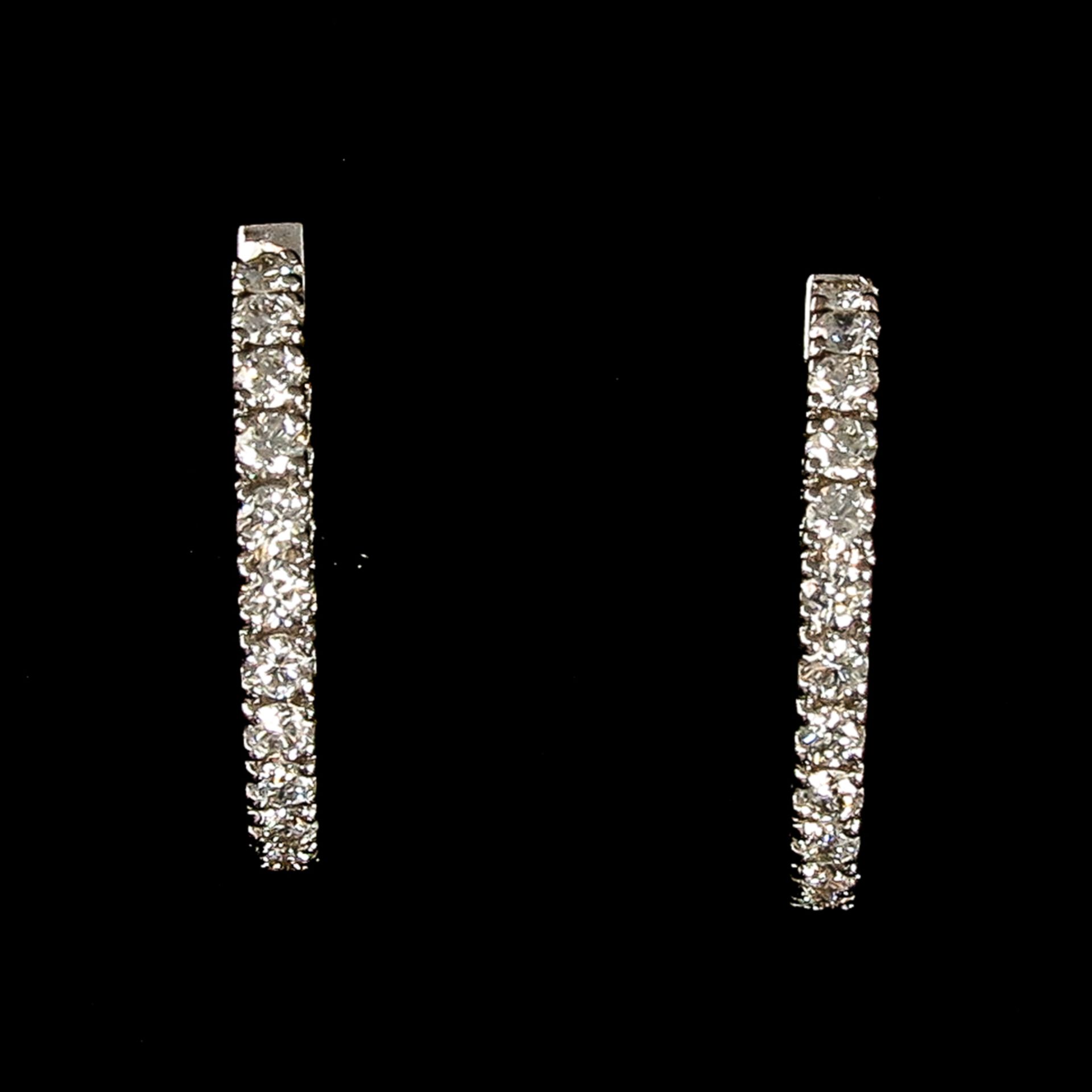 A Pair of 18KG Diamond Earrings