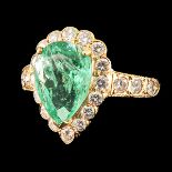 A 18KG Diamond and Emerald Ring