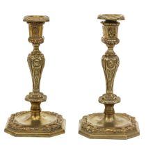 A Pair of Bronze Candlesticks