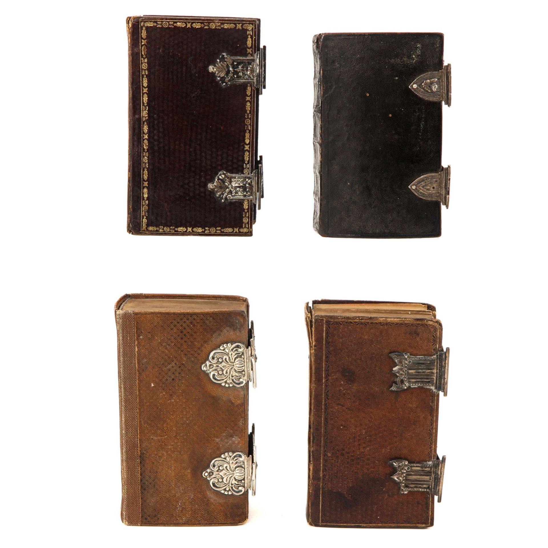 A Collection of 4 Bibles - Image 4 of 10