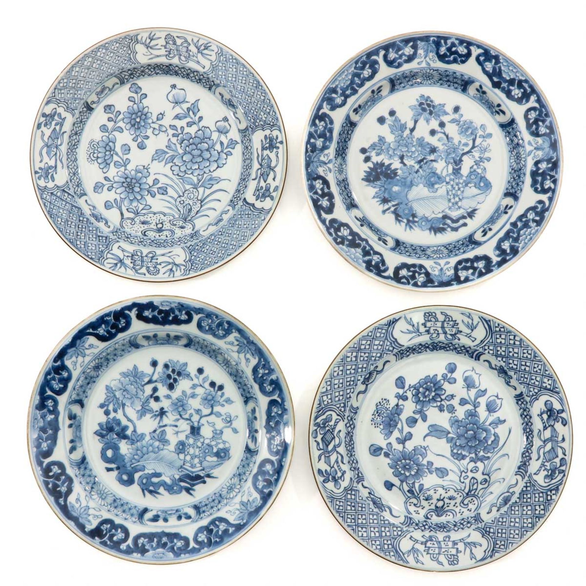 A Collection of 4 Blue and White Plates