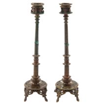 A Pair of Bronze Candlesticks