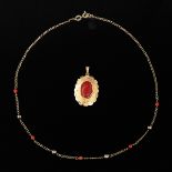 A 14k Gold Necklace and Red Coral Pendant