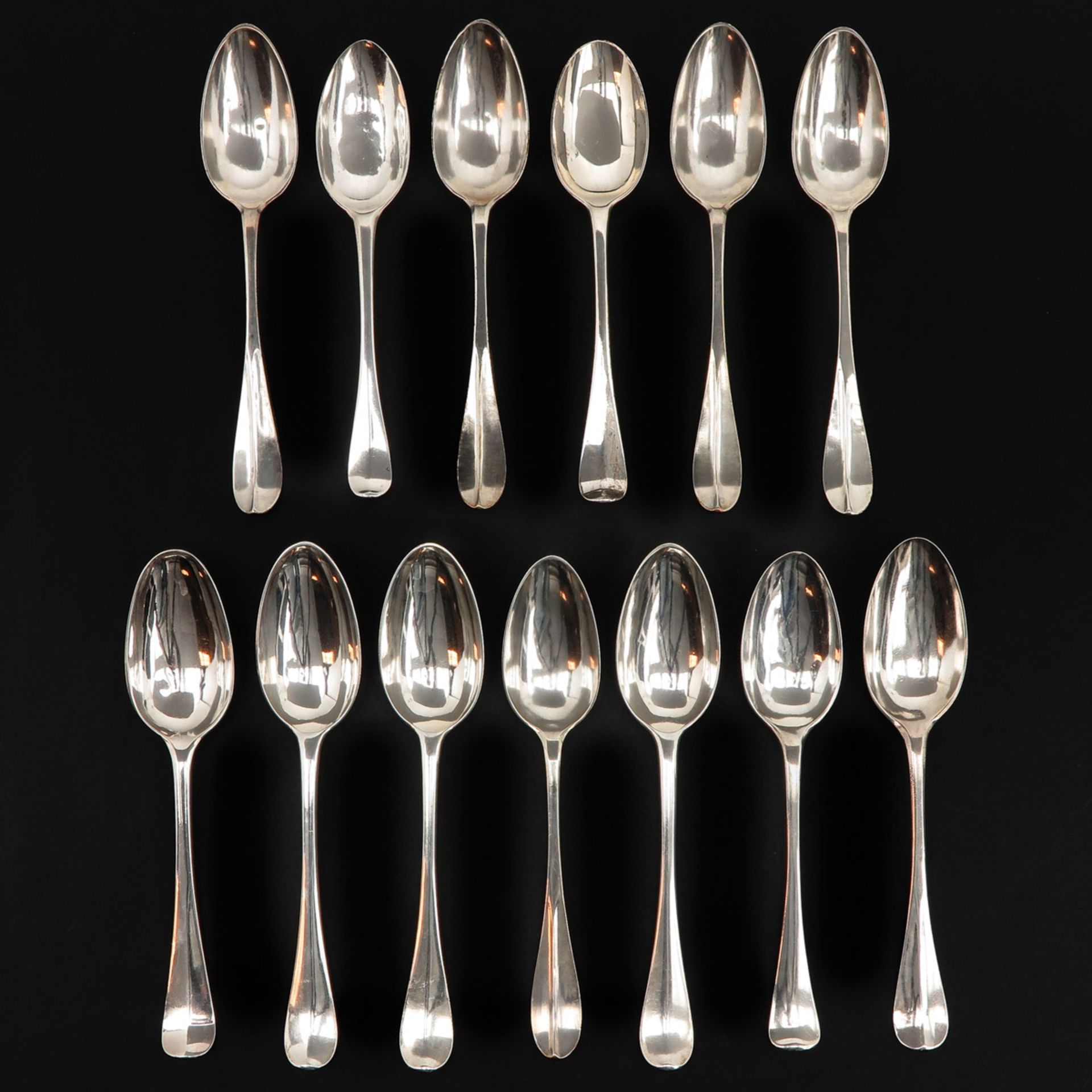 A Collection of 13 Silver Spoons