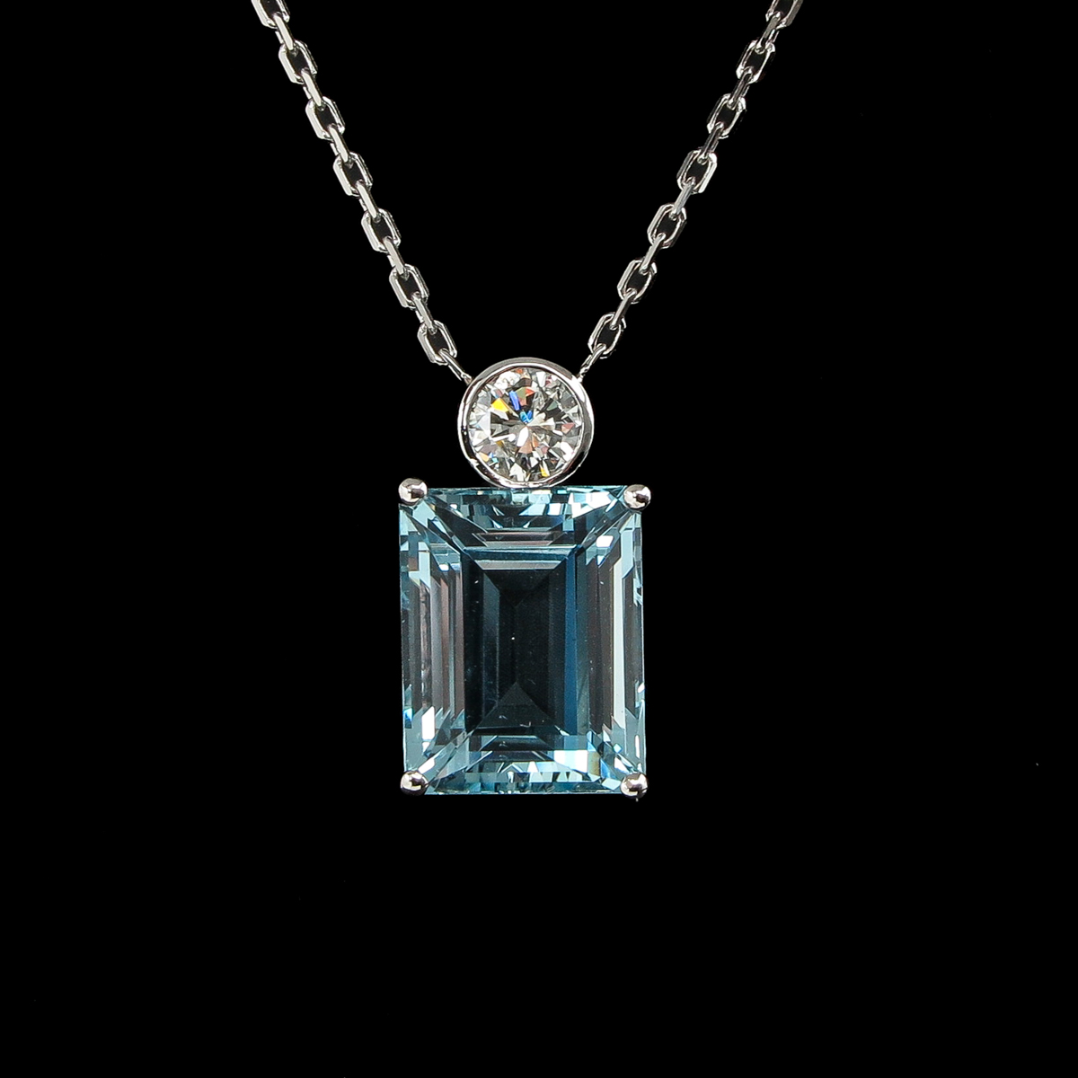 A Necklace with Emerald Cut Aquamarine and Diamond Pendant