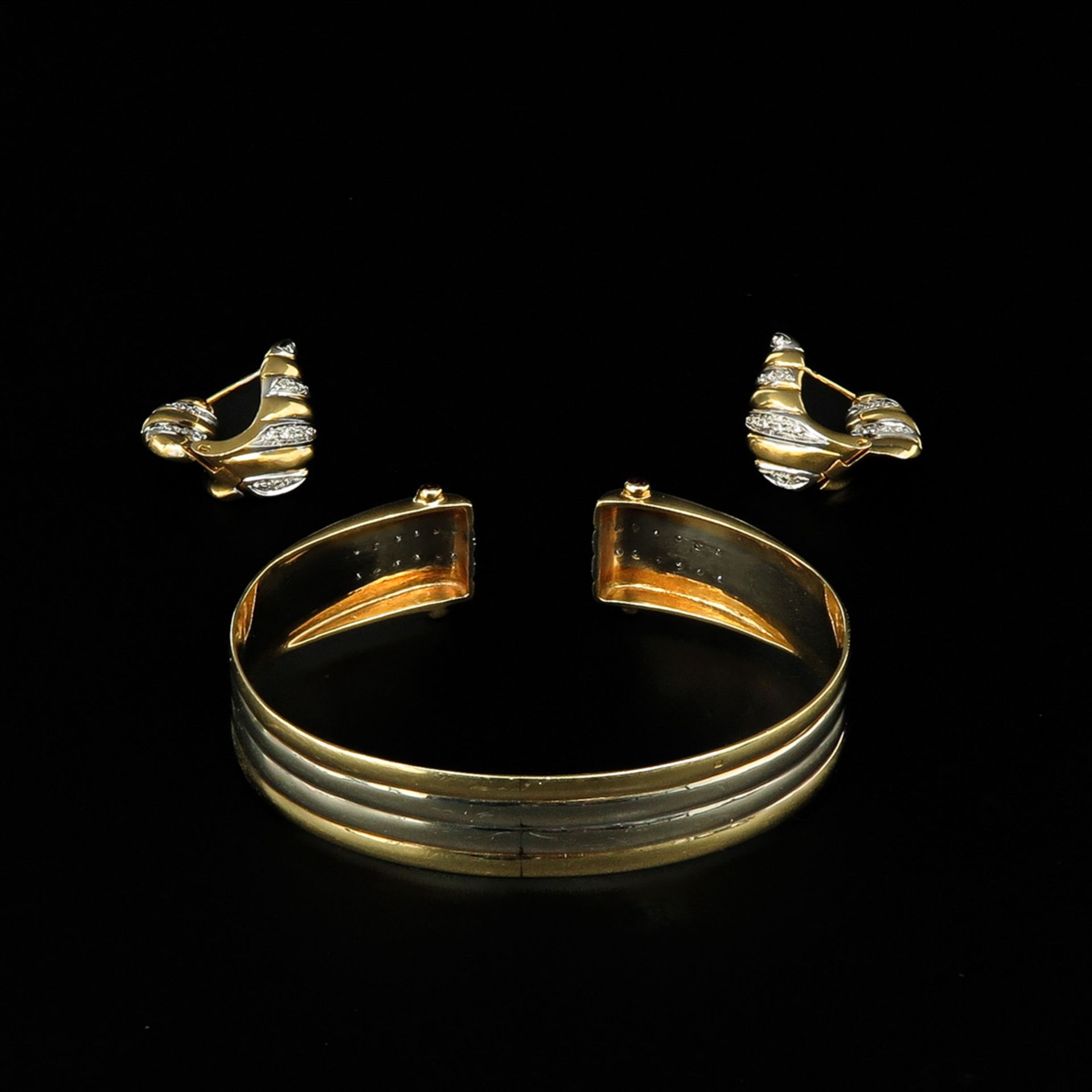 A Diamond Bracelet and Earrings