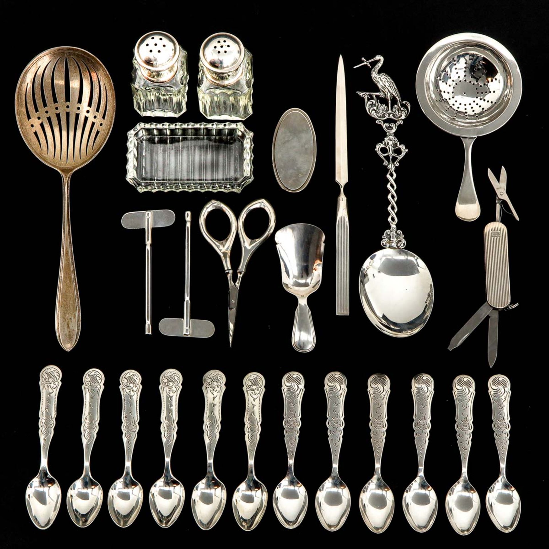 A Collection of 23 Pieces of Silver