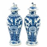 A Pair of Blue and White Vases with Covers