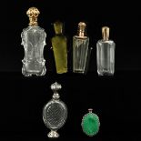 A Collection of 5 Perfume Bottles