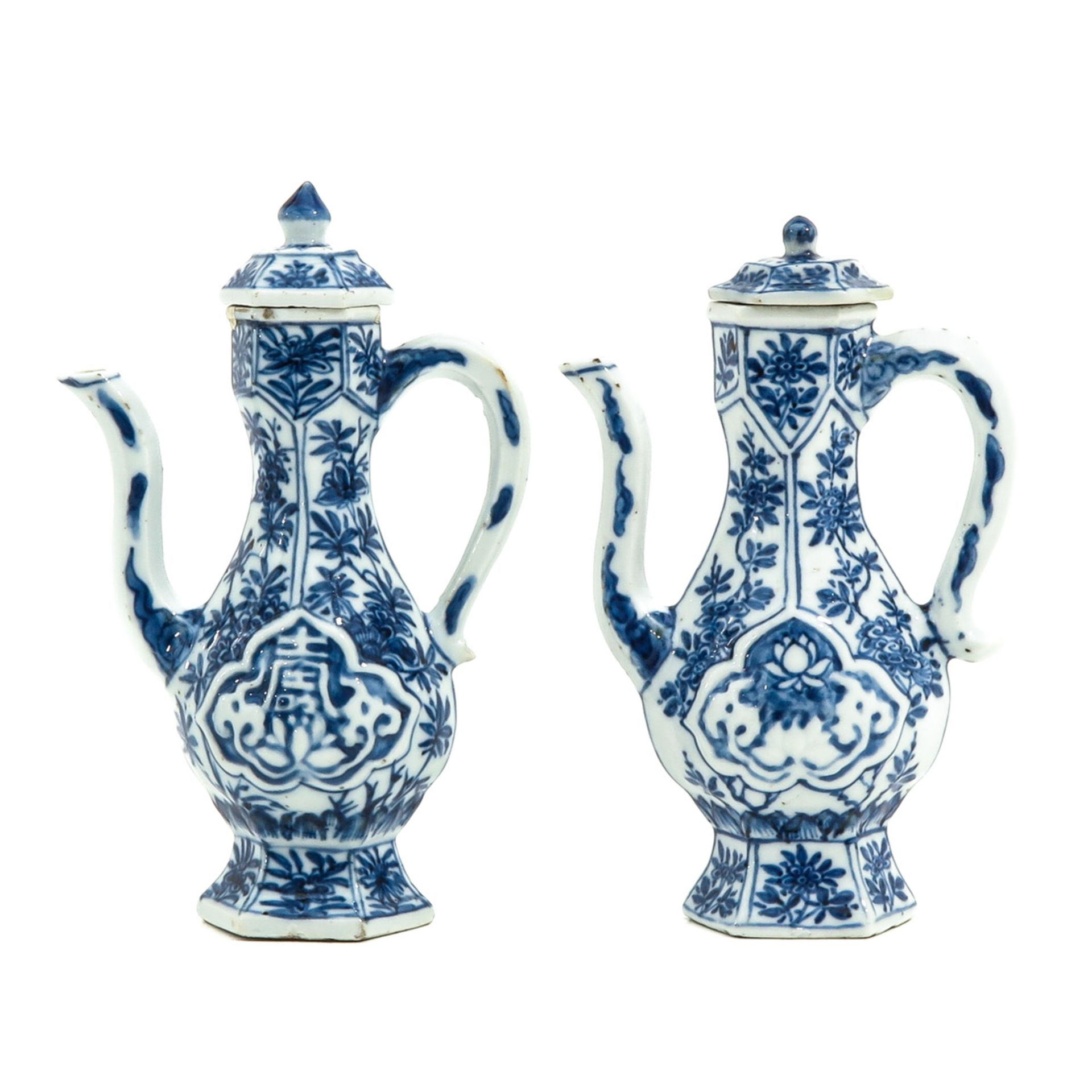 A Pair of Blue and White Cruets