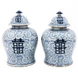 A Pair of Blue and White Jars with Covers