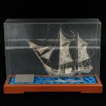 A Miniature Silver Sail Boat