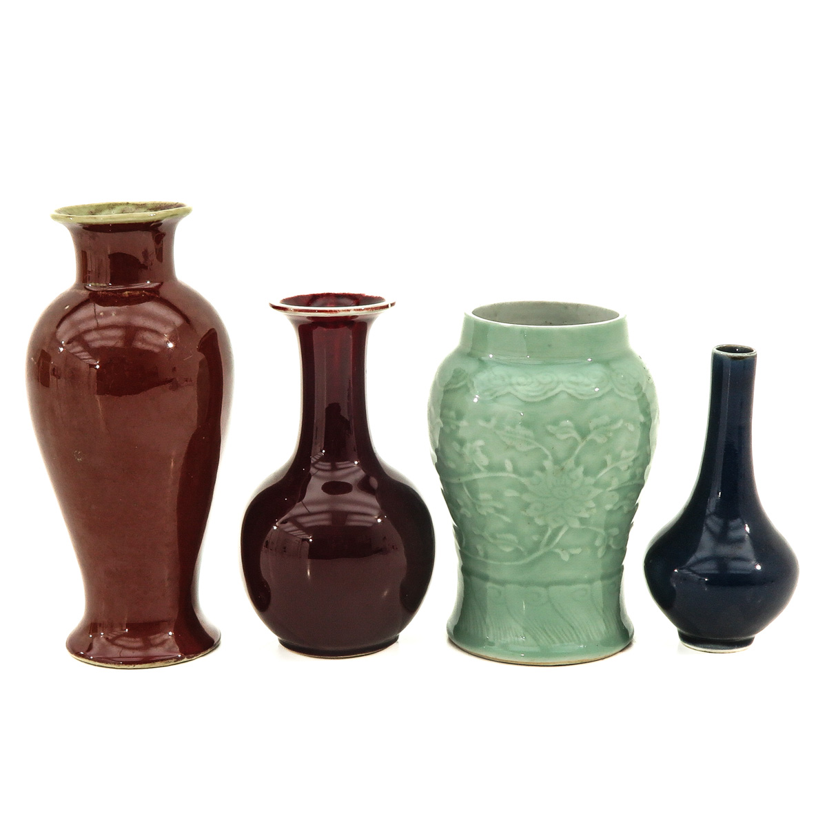 A Collection of 4 Monochrome Decor Vases