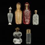 A Collection of 5 Perfume Bottles