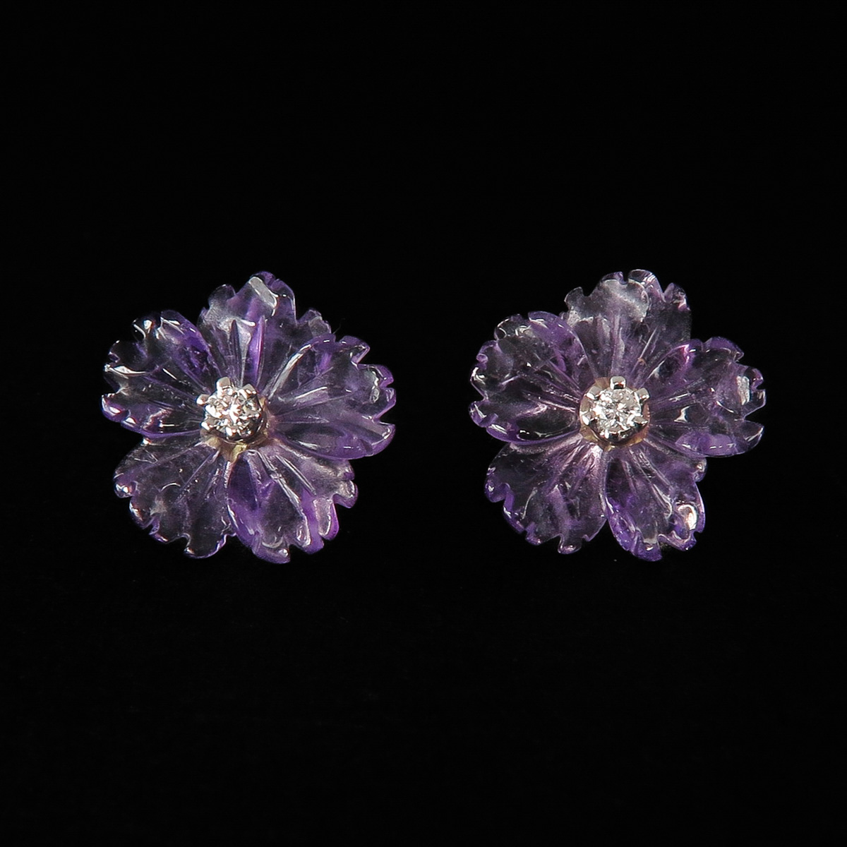 A Pair of Diamond and Amethyst Earrings