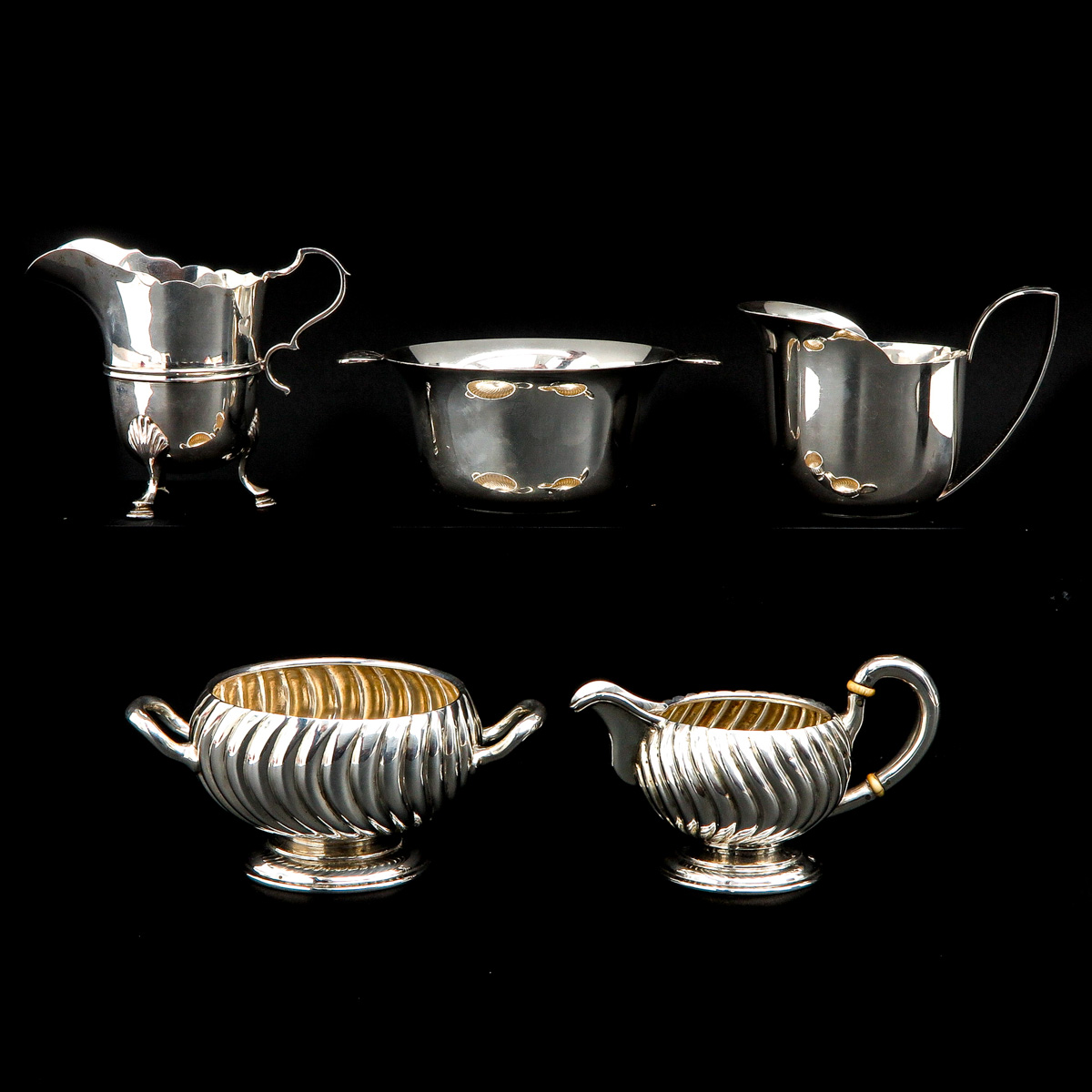 A Collection of 5 Pieces of Silver