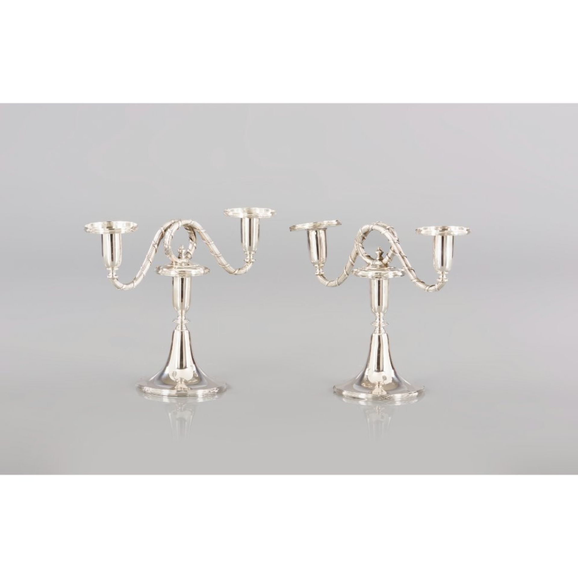 A Pair of two-light serpentine candelabra