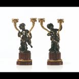  A pair of Louis XVI style two-light candelabra