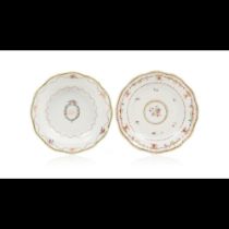 A pair of two small scalloped plates