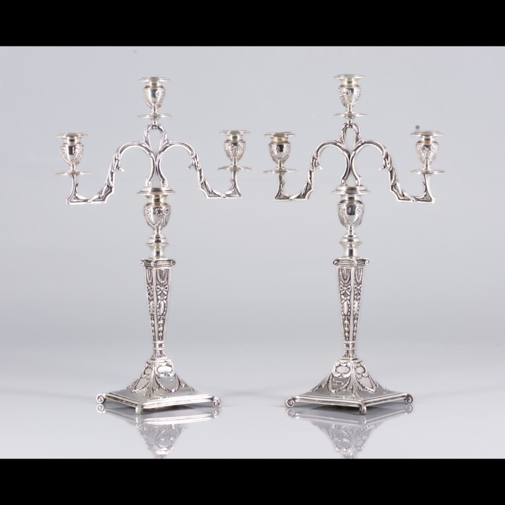  A pair of three branch candelabra