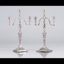 A pair of three branch candelabra