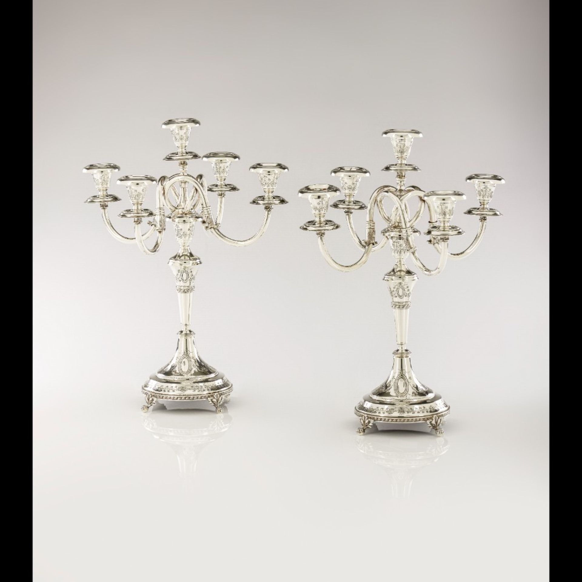  A pair of five branch candelabra