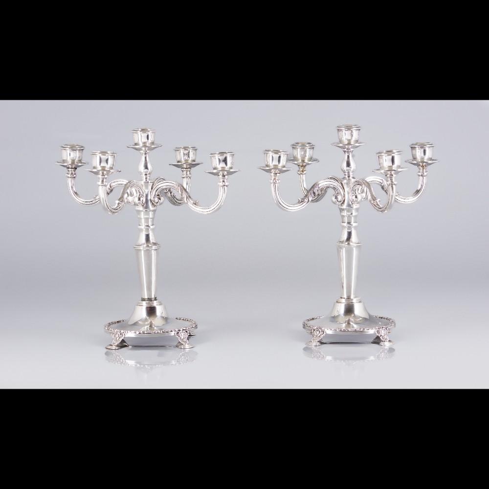  A pair of five branch candelabra