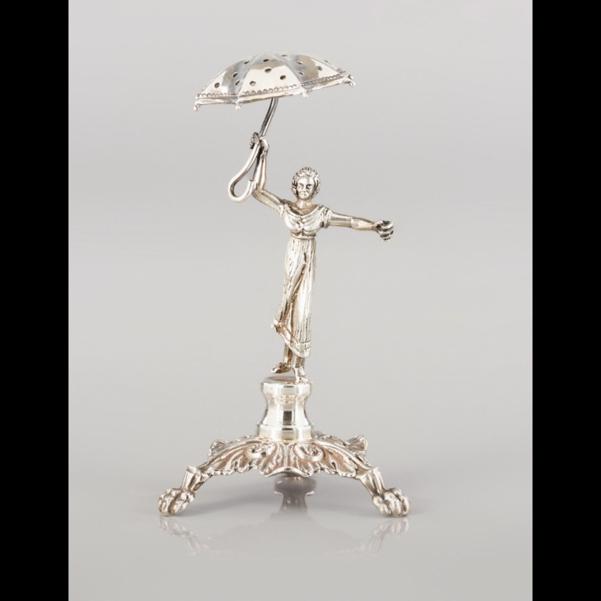  A "Lady with an umbrella" Toothpick Holder