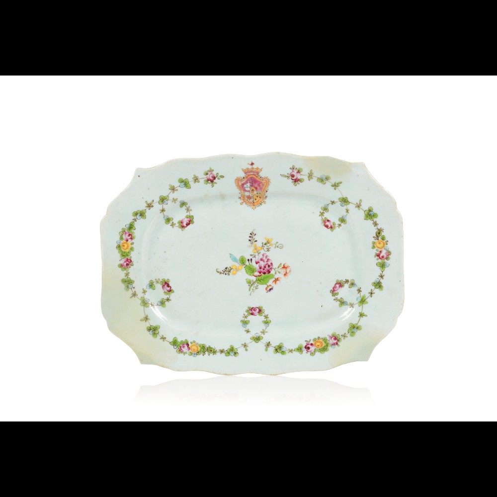  A scalloped armorial serving platter