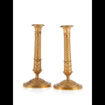 A pair of Empire style candlesticks