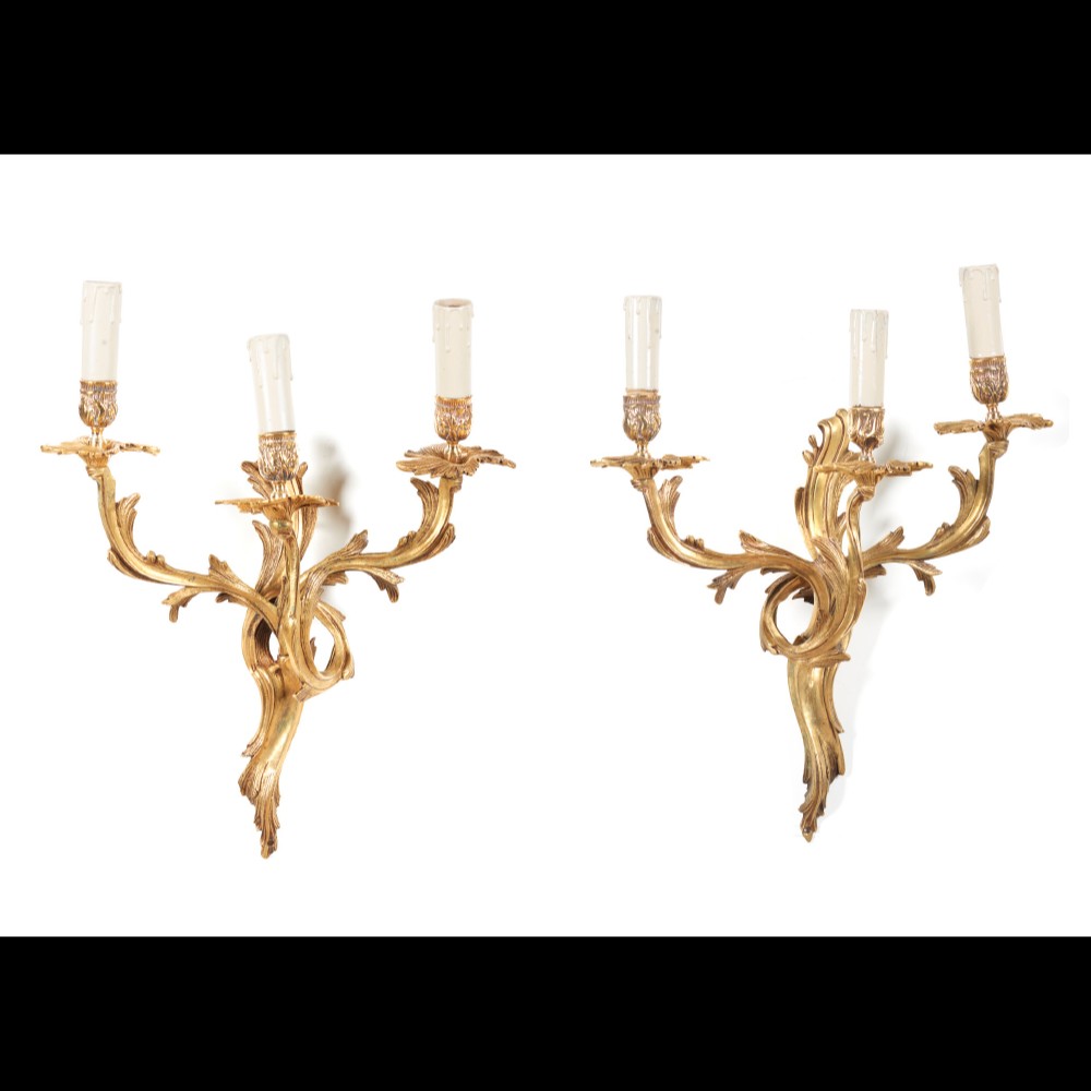  A pair of Louis XV style three branch wall sconces