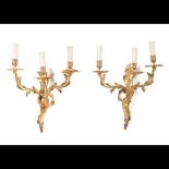  A pair of Louis XV style three branch wall sconces