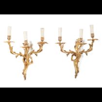 A pair of Louis XV style three branch wall sconces