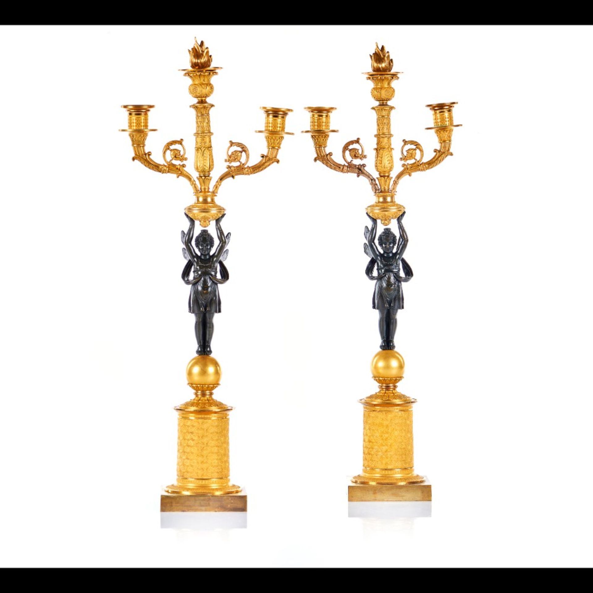  A pair of Empire three branch candelabra