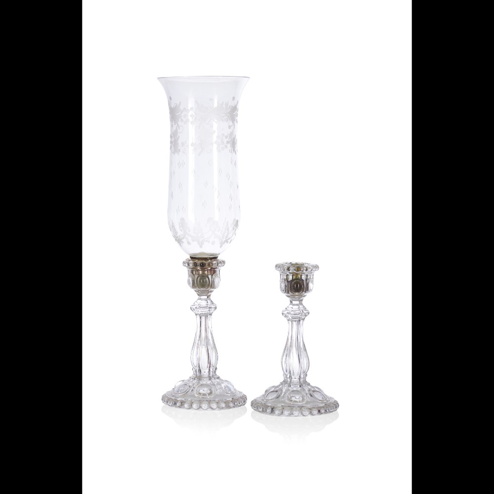  A pair of crystal and glass candlesticks