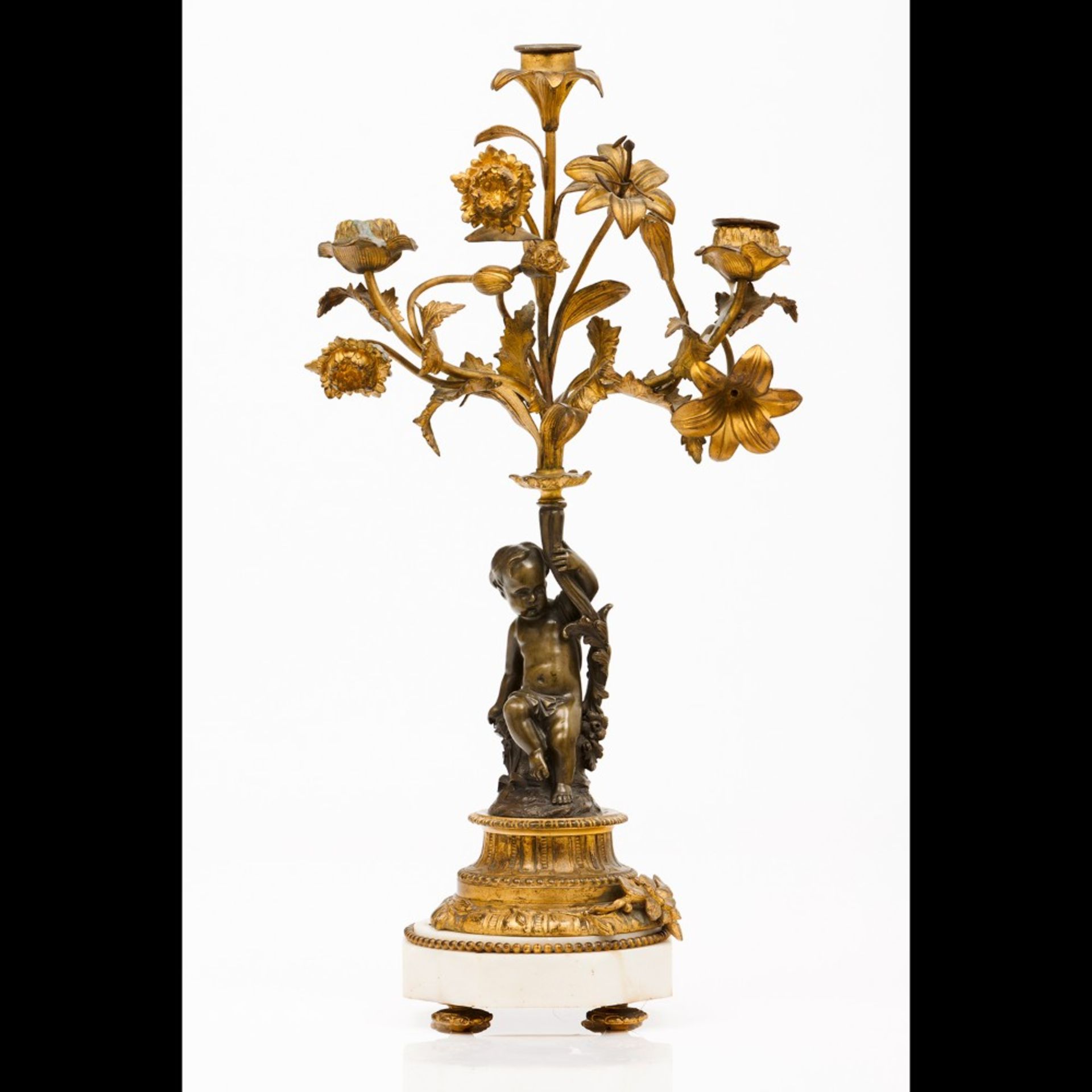 A Louis XVI style three branch candelabra