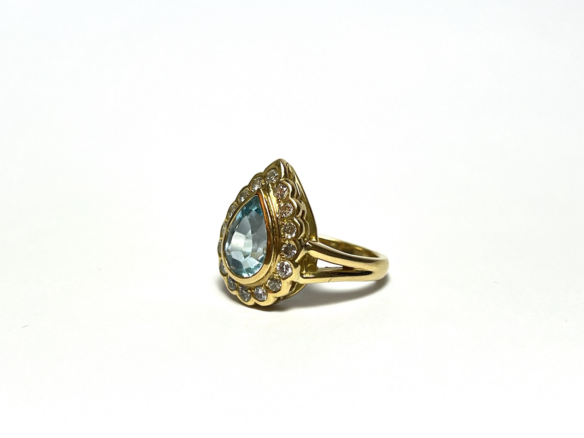 Diamond ring with blue topaz