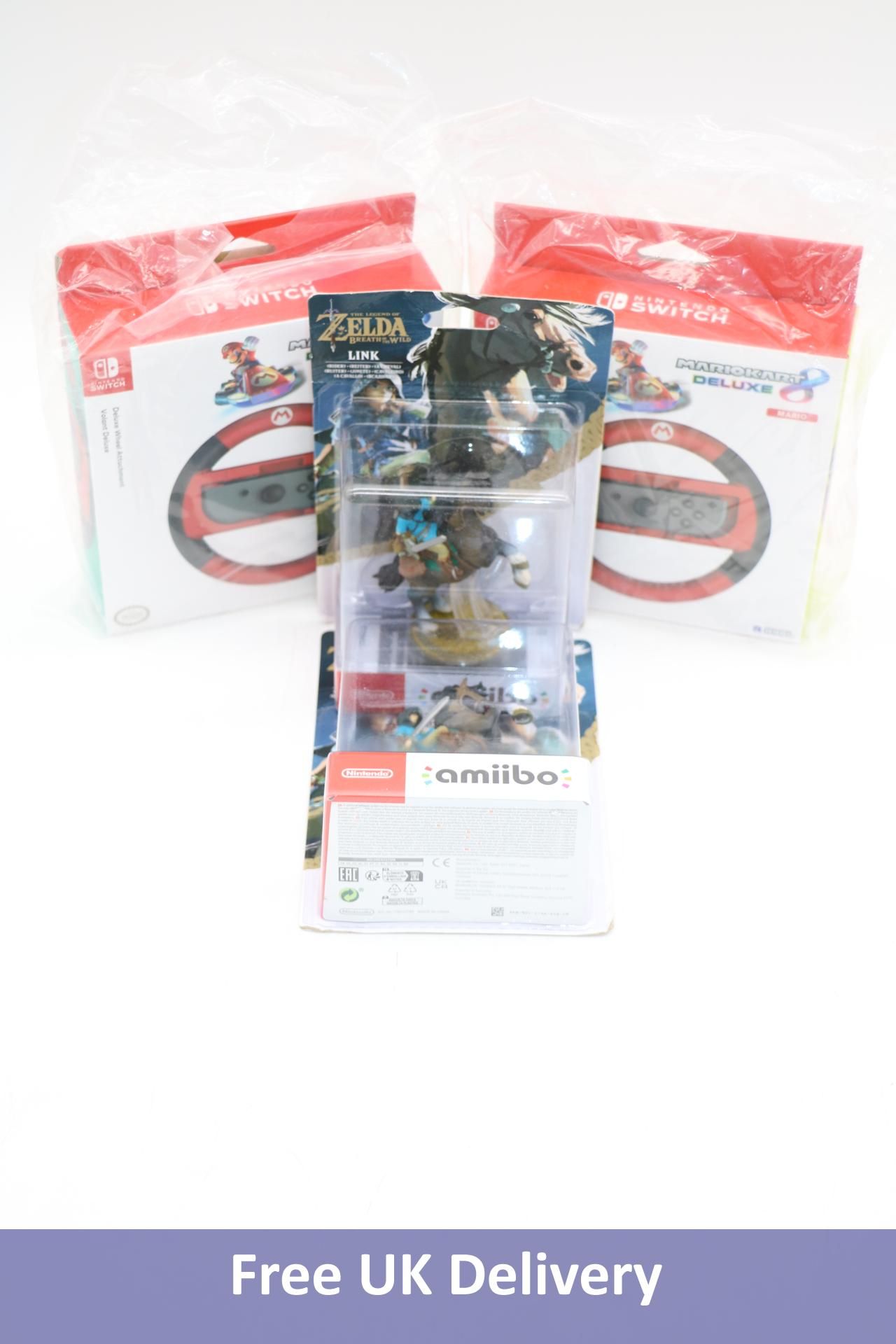 Four Nintendo items to include 2x Mario Cart Deluxe Wheel Attachment for Switch, 2x Amiibo Breath of