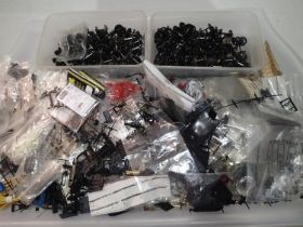 Selection of OO gauge locomotive spares including wheels, buffers, brake parts, couplings, detailing