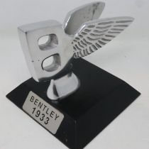 Polished aluminium Bentley B on a base, H: 13 cm. UK P&P Group 2 (£20+VAT for the first lot and £4+