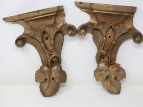 Pair of gilt carved wood corbels, both with losses, H: 34 cm. Not available for in-house P&P